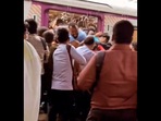 Snapshot of the man struggling to come out of the Mumbai local train. Snapshot of the man struggling to come out of the Mumbai local train.
