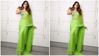 Janhvi Kapoor's saree comes in a captivating shade of green and features a striking silver sequin border all over adding a glam touch. She draped it elegantly around her with letting the pallu beautifully fall from the shoulders. (Instagram/@stylebyami) Janhvi Kapoor's saree comes in a captivating shade of green and features a striking silver sequin border all over adding a glam touch. She draped it elegantly around her with letting the pallu beautifully fall from the shoulders. (Instagram/@stylebyami)