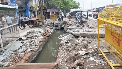 A 22-year-old woman and her three-year-old son drowned into a half-open, under-construction drain in a waterlogged street in the Ghazipur area in east Delhi on July 31. (Sakib Ali /HT Photo) A 22-year-old woman and her three-year-old son drowned into a half-open, under-construction drain in a waterlogged street in the Ghazipur area in east Delhi on July 31. (Sakib Ali /HT Photo)