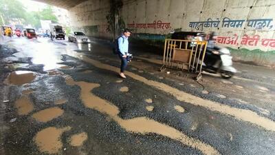 A road riddled with potholes in Narhe area that was merged with PMC. Residents claim the civic body has failed to provide basic infrastructure to its 34 villages merged since 2017. (MAHENDRA KOLHE/HT) A road riddled with potholes in Narhe area that was merged with PMC. Residents claim the civic body has failed to provide basic infrastructure to its 34 villages merged since 2017. (MAHENDRA KOLHE/HT)