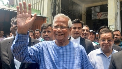 Sheikh Hasina resignation LIVE: Bangladesh's Nobel Laureate Muhammad Yunus (C) (AFP)