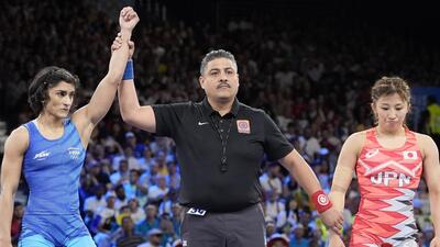 India's Vinesh Phogat after defeating Japan's Yui Susaki in the round of 16 of the women's freestyle 50kg wrestling. (AP) India's Vinesh Phogat after defeating Japan's Yui Susaki in the round of 16 of the women's freestyle 50kg wrestling. (AP)