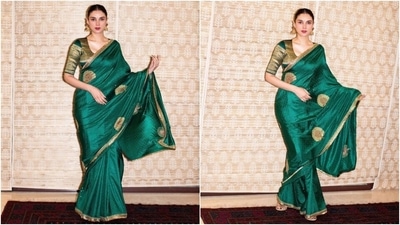 Love sarees? Aditi Rao Hydari demonstrates how to elegantly rock a green saree. Her stunning saree from the celebrity-favorite brand Raw Mango features purple thread embroidery, gold peacock embellishments, and an intricate golden patti design on the borders. Paired with a golden blouse and jhumka earrings, she exudes glamour. (Instagram) Love sarees? Aditi Rao Hydari demonstrates how to elegantly rock a green saree. Her stunning saree from the celebrity-favorite brand Raw Mango features purple thread embroidery, gold peacock embellishments, and an intricate golden patti design on the borders. Paired with a golden blouse and jhumka earrings, she exudes glamour. (Instagram)