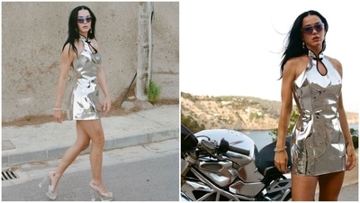 Katy Perry's latest look in a silver metallic mini dress with a halter neckline redefines sartorial elegance. Paired with diamond statement earrings, a sleek bracelet, tinted sunglasses, and transparent heels, she exudes pure glamour. (Instagram/@katyperry) Katy Perry's latest look in a silver metallic mini dress with a halter neckline redefines sartorial elegance. Paired with diamond statement earrings, a sleek bracelet, tinted sunglasses, and transparent heels, she exudes pure glamour. (Instagram/@katyperry)