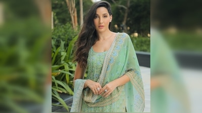 Nothing can match the elegance of a simple suit, and Nora Fatehi's ethnic look is proof of that. Her outfit features a straight-line embroidered sleeveless kurta and a matching dupatta. With minimal makeup and loose tresses, she completes her look effortlessly. (Instagram/@norafatehi) Nothing can match the elegance of a simple suit, and Nora Fatehi's ethnic look is proof of that. Her outfit features a straight-line embroidered sleeveless kurta and a matching dupatta. With minimal makeup and loose tresses, she completes her look effortlessly. (Instagram/@norafatehi)