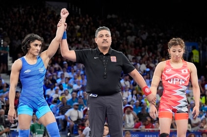 India's Vinesh Phogat, left, celebrates after defeating Japan's Yui Susaki in the round of 16 of the women's freestyle 50kg wrestling match (AP) India's Vinesh Phogat, left, celebrates after defeating Japan's Yui Susaki in the round of 16 of the women's freestyle 50kg wrestling match (AP)