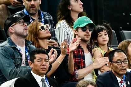US actress Eva Mendes (C-L) and her partner Canadian actor Ryan Gosling (C-R) attend the artistic gymnastics women's uneven bars final during the Paris 2024 Olympic Games at the Bercy Arena in Paris, on August 4, 2024. (Photo by Loic VENANCE / AFP) (AFP) US actress Eva Mendes (C-L) and her partner Canadian actor Ryan Gosling (C-R) attend the artistic gymnastics women's uneven bars final during the Paris 2024 Olympic Games at the Bercy Arena in Paris, on August 4, 2024. (Photo by Loic VENANCE / AFP) (AFP)