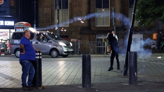 Protestors throw fireworks as the riots continue into the night in Liverpool, Britain, August 3, 2024. REUTERS/ Belinda Jiao(REUTERS)