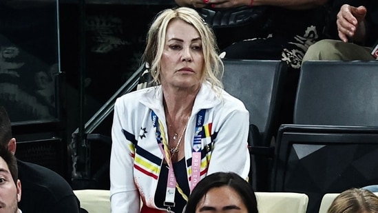 Romanian former gymnast Nadia Comaneci (C) attends the artistic gymnastics women's team final during the Paris 2024 Olympic Games at the Bercy Arena in Paris, on July 30, 2024. (Photo by Anne-Christine POUJOULAT / AFP)(AFP)