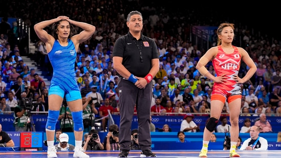 India's Vinesh Phogat reacts after the round of 16 of the women's freestyle 50kg wrestling match against Japan's Yui Susaki(PTI)