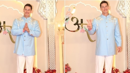 John Cena strikes a pose at the Ambani wedding in a light blue bandhagala kurta and white pants. He styled the look with tan brown dress shoes.(HT Photo/Varinder Chawla)