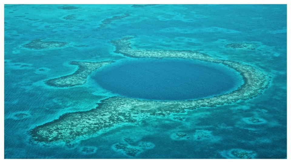 A long time back a limestone cave submerged as water levels rose, to form today's Great Blue Hole.