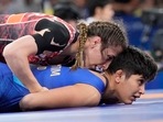 Turkey's Zeynep Yetgil and India's Antim Antim, right, compete in the round of 16 of the women's freestyle 53kg wrestling match, at Champ-de-Mars Arena, during the 2024 Summer Olympics