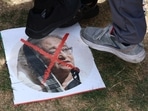 Protesters step on a poster of Sheikh Hasina.(Reuters Photo)