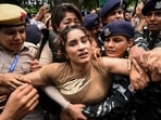 Indian wrestler Vinesh Phogat (C) detained by the police during a protest against Brij Bhushan Singh, the wrestling federation chief on July 23, 2024 (Photo by Arun THAKUR / AFP)(AFP) Indian wrestler Vinesh Phogat (C) detained by the police during a protest against Brij Bhushan Singh, the wrestling federation chief on July 23, 2024 (Photo by Arun THAKUR / AFP)(AFP)