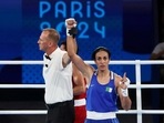 Referee raises the arm of Imane Khelif of Algeria after winning her fight against Janjaem Suwannapheng of Thailand