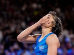 India's Vinesh Phogat reacts after the round of 16 of the women's freestyle 50kg wrestling match against Japan's Yui Susaki, at Champ-de-Mars Arena India's Vinesh Phogat reacts after the round of 16 of the women's freestyle 50kg wrestling match against Japan's Yui Susaki, at Champ-de-Mars Arena