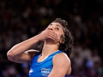 India's Vinesh Phogat reacts after the round of 16 of the women's freestyle 50kg wrestling match against Japan's Yui Susaki, at Champ-de-Mars Arena India's Vinesh Phogat reacts after the round of 16 of the women's freestyle 50kg wrestling match against Japan's Yui Susaki, at Champ-de-Mars Arena