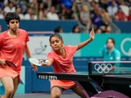 Sreeja Akula (R) and Archana Girish Kamath of India play against Yuan Wan and Shan Xiaona of Germany in the Women's Team Quarterfinal match