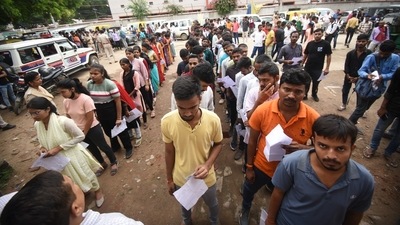 Candidates stand in a queue waiting for their turn to enter the exam hall in Patna to attempt the Bihar Police Constable exam. (Santosh Kumar) Candidates stand in a queue waiting for their turn to enter the exam hall in Patna to attempt the Bihar Police Constable exam. (Santosh Kumar)
