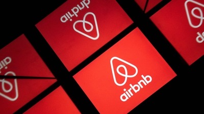 This illustration picture taken on November 22, 2019, shows the logo of the online lodging service Airbnb displayed on a tablet in Paris. (AFP)