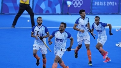 India's Harmanpreet Singh, third left, celebrates after scoring his side's first goal against Germany, on Tuesday. (AP) India's Harmanpreet Singh, third left, celebrates after scoring his side's first goal against Germany, on Tuesday. (AP)