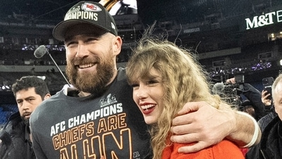 FILE - Kansas City Chiefs tight end Travis Kelce and Taylor Swift walk together after an AFC Championship NFL football game between the Chiefs and the Baltimore Ravens, Jan. 28, 2024, in Baltimore.. Taylor Swift, who is holding concerts in Japan, will make it in time for the Super Bowl to see her partner and football superstar Travis Kelce play. (AP Photo/Julio Cortez, File) (AP)