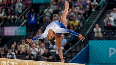 Paris: US gymnast Simon Biles performs on the balance beam at the 2024 Summer Olympics, in Paris, France, Monday, Aug. 5, 2024. (PTI) Paris: US gymnast Simon Biles performs on the balance beam at the 2024 Summer Olympics, in Paris, France, Monday, Aug. 5, 2024. (PTI)