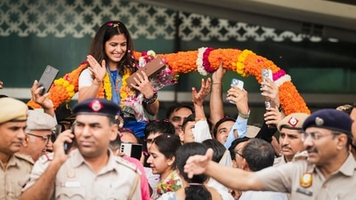 Markswoman Manu Bhaker being welcomed upon her arrival at the airport, in New Delhi, Wednesday, Aug. 7, 2024. Bhaker, India's first to win two Olympic medals in a single edition, arrived Delhi after a successful campaign at the Paris Games 2024 (PTI) Markswoman Manu Bhaker being welcomed upon her arrival at the airport, in New Delhi, Wednesday, Aug. 7, 2024. Bhaker, India's first to win two Olympic medals in a single edition, arrived Delhi after a successful campaign at the Paris Games 2024 (PTI)