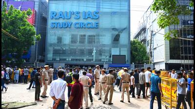 Security outside Rau's Study Circle following flooding that left three students dead. (HT PHOTO) Security outside Rau's Study Circle following flooding that left three students dead. (HT PHOTO)
