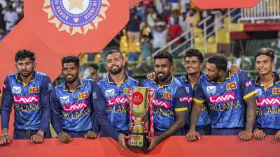 Sri Lankan players pose with the trophy after winning the ODI series against India. (PTI) Sri Lankan players pose with the trophy after winning the ODI series against India. (PTI)