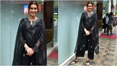 Kriti Sanon stepped out in Mumbai wearing a beautiful black chikankari suit. She paired the cotton ensemble with matching Kolhapuri sandals, jhumkis, a messy hairdo, minimal makeup, a dainty bracelet, and pink lips.&nbsp; (Instagram)