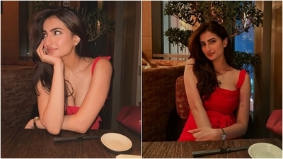 Palak Tiwari looks stunning in a red dress featuring a plunging neckline, twisted shoulder straps tied on the back, a draped silhouette, and a bow tie detail under the bust. She paired the sleeveless ensemble with a dainty necklace, a watch, minimal makeup, and loose tresses.&nbsp; (Instagram)
