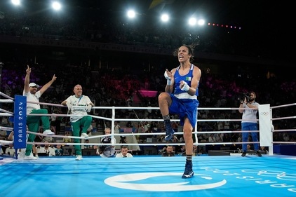 Algeria's Imane Khelif celebrates after defeating Thailand's Janjaem Suwannapheng in women's 66 kg semifinal boxing match (AP)