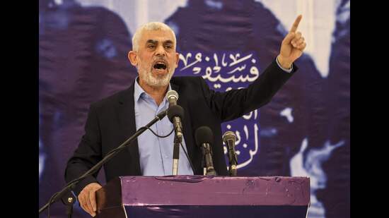 (FILES) Head of the political wing of the Palestinian Hamas movement in the Gaza Strip Yahya Sinwar speaks during a meeting in Gaza City on April 30, 2022. (Photo by Mahmud HAMS / AFP) (AFP)