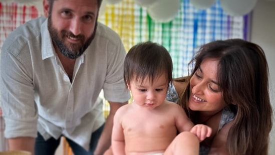 Actor Ileana D'Cruz shared a bunch of pictures as her son Koa Phoenix Dolan clocked his first birthday. Taking to Instagram, Ileana posted a picture with her beau Michael Dolan and Koa as they smiled for the camera. In the photo, Ileana wore a printed blue dress, while Michael was seen in a white shirt and pants. Koa was seen looking away from the camera.&nbsp;