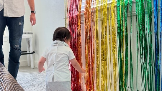 Sharing the pictures, Ileana D'Cruz captioned the post, "Where did the time go?? (Face holding back tears emoji). Just like that, my baby is 1 (red heart, nazar amulet, and sparkles emojis)."