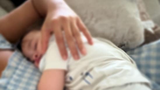 In a photo, Koa rested on his mother Ileana D'Cruz's chest as she lay on the bed.