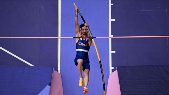 An overview shows France's Anthony Ammirati competing in the men's pole vault qualification of the athletics event at the Paris 2024 Olympic Games at Stade de France in Saint-Denis(AFP)