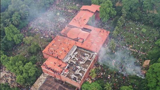 An aerial view shows anti-government protestors storming former Bangladesh prime minister Sheikh Hasina's palace in Dhaka. (AFP Photo)