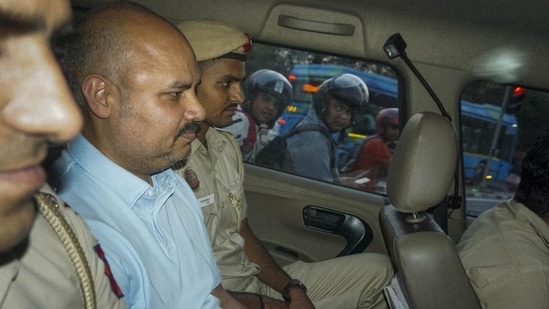 Delhi Police with chief minister Arvind Kejriwal’s aide Bibhav Kumar leave CM's residence after recreation of the scene in AAP MP Swati Maliwal's assault case in May, 2024. (PTI)