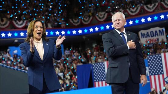 Democratic presidential candidate, US Vice-President Kamala Harris and Democratic vice-presidential candidate Minnesota Governor Tim Walz appear on stage together during a campaign event at Girard College in Philadelphia, Pennsylvania, on Tuesday. (AFP)