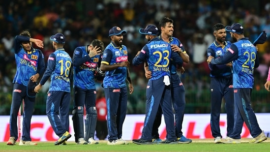 Sri Lanka's players celebrate after winning the third and final one-day international (ODI) cricket match against India.(AFP)