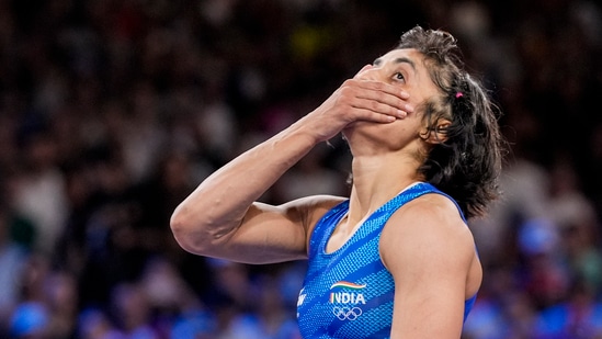 India's Vinesh Phogat reacts after the round of 16 of the women's freestyle 50kg wrestling match against Japan's Yui Susaki, at Champ-de-Mars Arena(PTI)