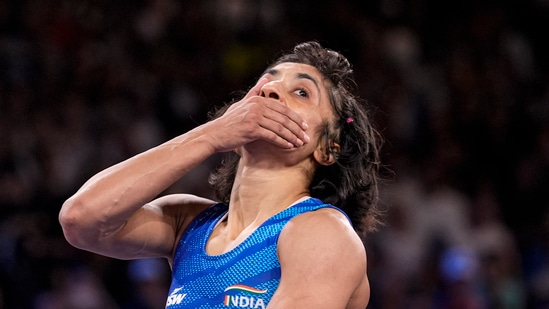 India's Vinesh Phogat reacts after the round of 16 of the women's freestyle 50kg wrestling match against Japan's Yui Susaki, at Champ-de-Mars Arena(PTI)