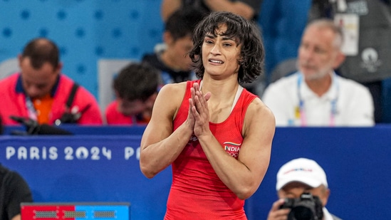 India's Vinesh Phogat celebrates after winning her Women's Freestyle 50kg semi-final wrestling match against Cuba's Yusneylys Guzman Lopez at the 2024 Summer Olympics(PTI)