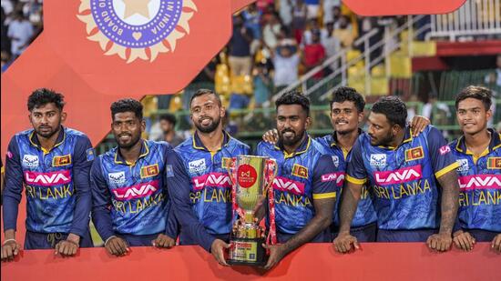 Sri Lankan players pose with the trophy after winning the ODI series against India. (PTI)