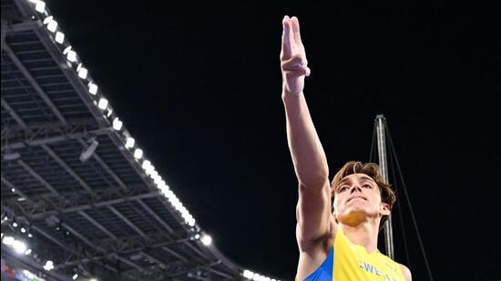 Sweden's Armand Duplantis celebrates after passing 6.10m and setting the new Olympic record, in Paris on Monday. (AFP)