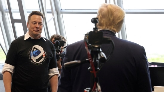 FILE PHOTO: U.S. President Donald Trump and Elon Musk are seen at the Firing Room Four after the launch of a SpaceX Falcon 9 rocket and Crew Dragon spacecraft on NASA's SpaceX Demo-2 mission to the International Space Station from NASA's Kennedy Space Center in Cape Canaveral, Florida, U.S. May 30, 2020. (REUTERS)