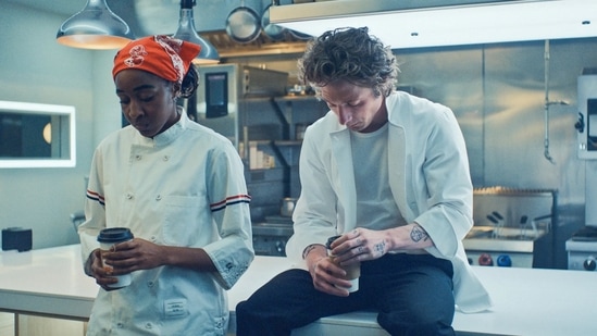 Ayo Edebiri and Jeremy Allen White in a still from The Bear Season 3.